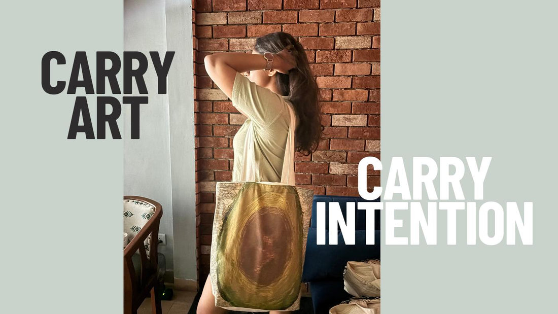 Woman carrying the Creative Coupling Avocado Tote Bag with abstract avocado-inspired artwork and the text "Carry Art, Carry Intention" against  a brick wall background